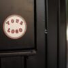 round-sticker-on-a-black-door-template-a14316